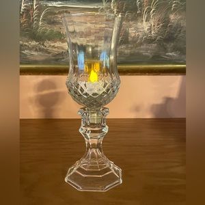 Bottom diamond cut peg votive holder with base.